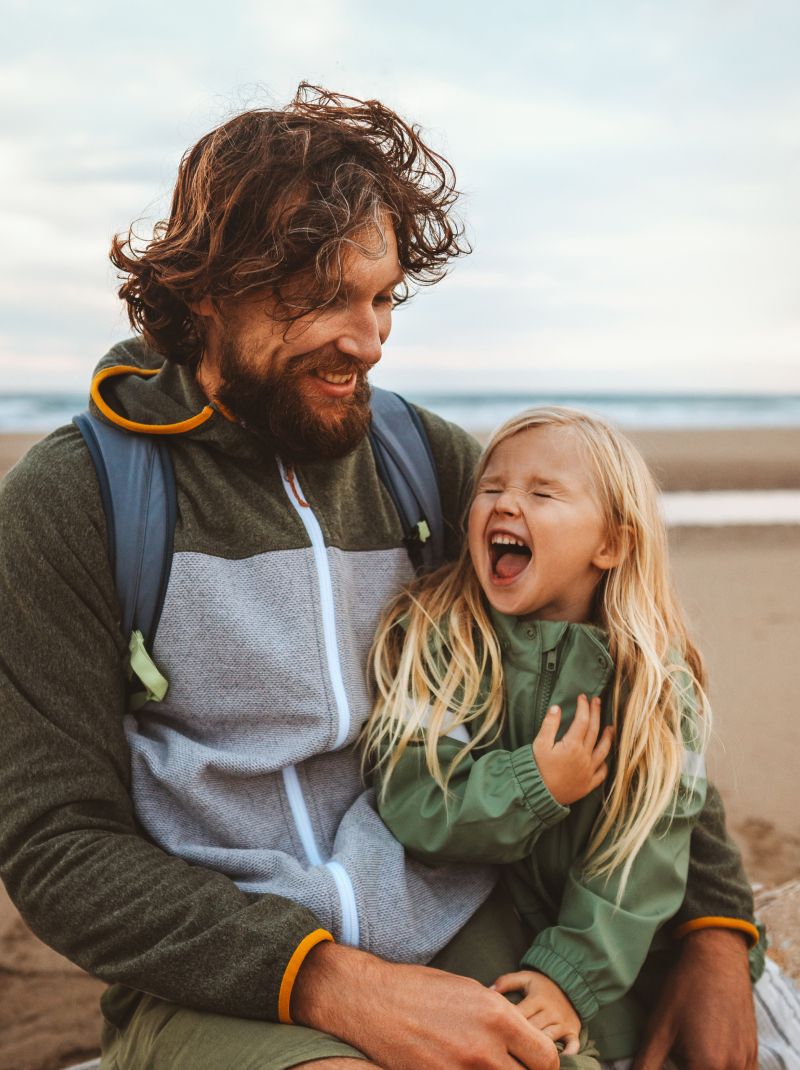 a person on the runway in front of a plane