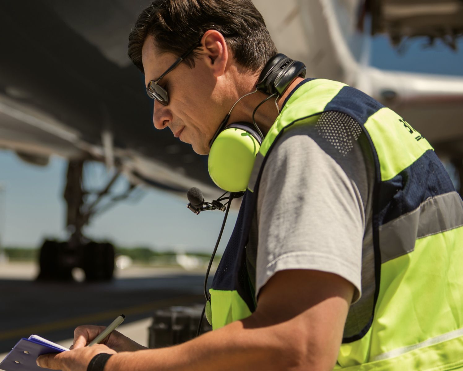 a ground engineer inspecting a plane